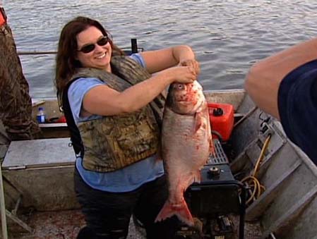 Becky Cudmore and a silver carp
